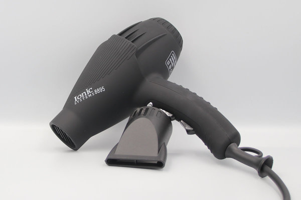 A black pet hair dryer lies against a white background. Next to it is an attachment for the hair dryer. Link: Category Dryer.