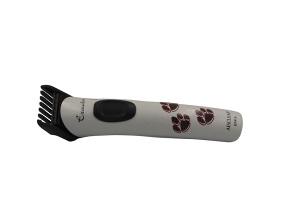 A white clipper from Aesculap with red and black paw motifs lies against a white background. Link: Category Aesculap clippers.